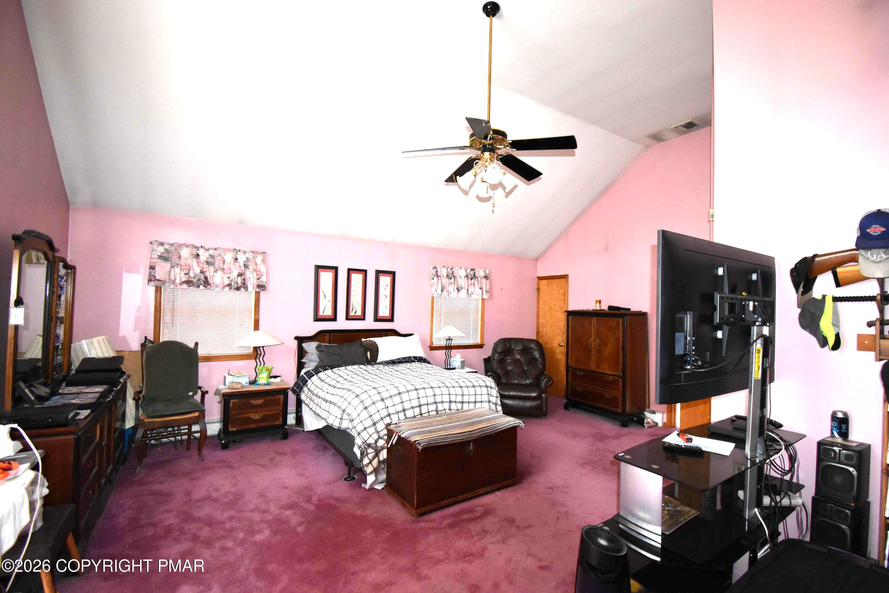 160 Quiet Valley Road Mount Bethel, PA 18343 - Photo 22 of 44 a bedroom with a bed dresser and a flat screen tv