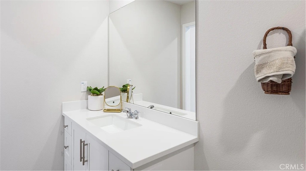 8451 Tapia Way Rancho Cucamonga, CA 91730 - Photo 11 of 26 a bathroom with a sink and a mirror