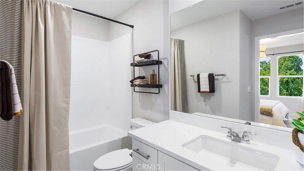 8451 Tapia Way Rancho Cucamonga, CA 91730 - Photo 13 of 26 a bathroom with a sink toilet and shower