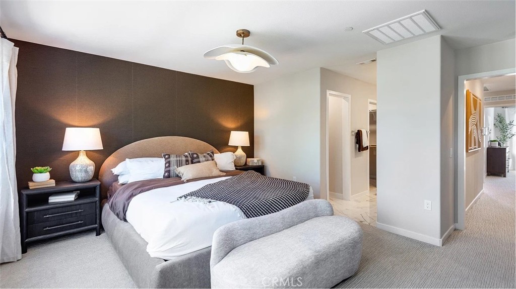 8451 Tapia Way Rancho Cucamonga, CA 91730 - Photo 15 of 26 a bedroom with a bed and a chandelier