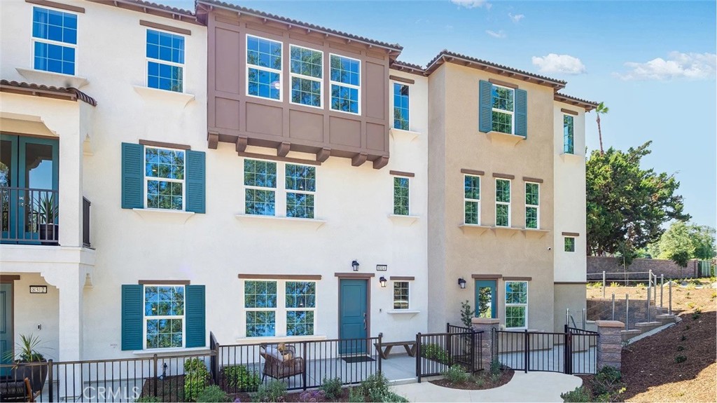 8451 Tapia Way Rancho Cucamonga, CA 91730 - Photo 19 of 26 a view of a building next to a yard