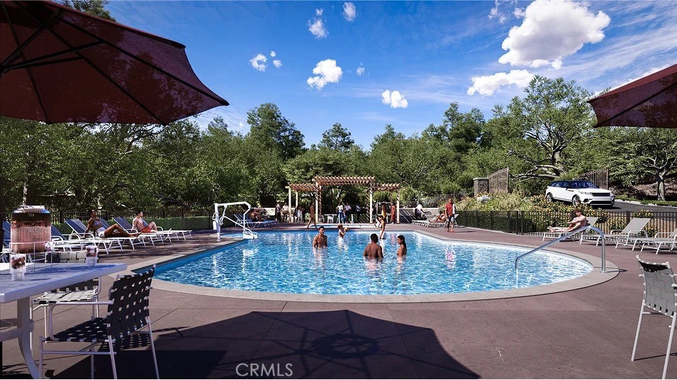 8451 Tapia Way Rancho Cucamonga, CA 91730 - Photo 22 of 26 a view of a swimming pool with outdoor seating
