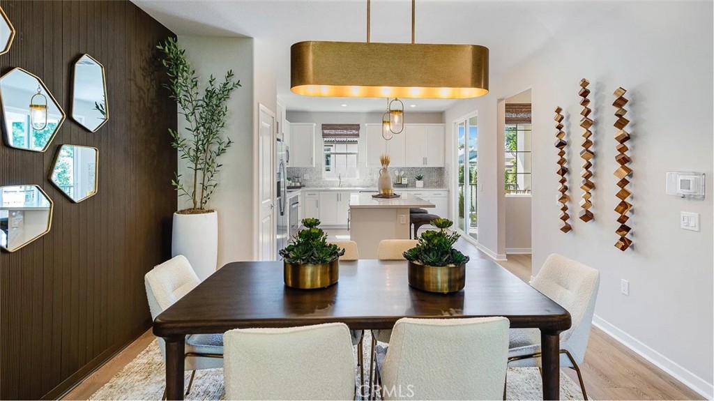 8451 Tapia Way Rancho Cucamonga, CA 91730 - Photo 6 of 26 a dining room with furniture and wooden floor