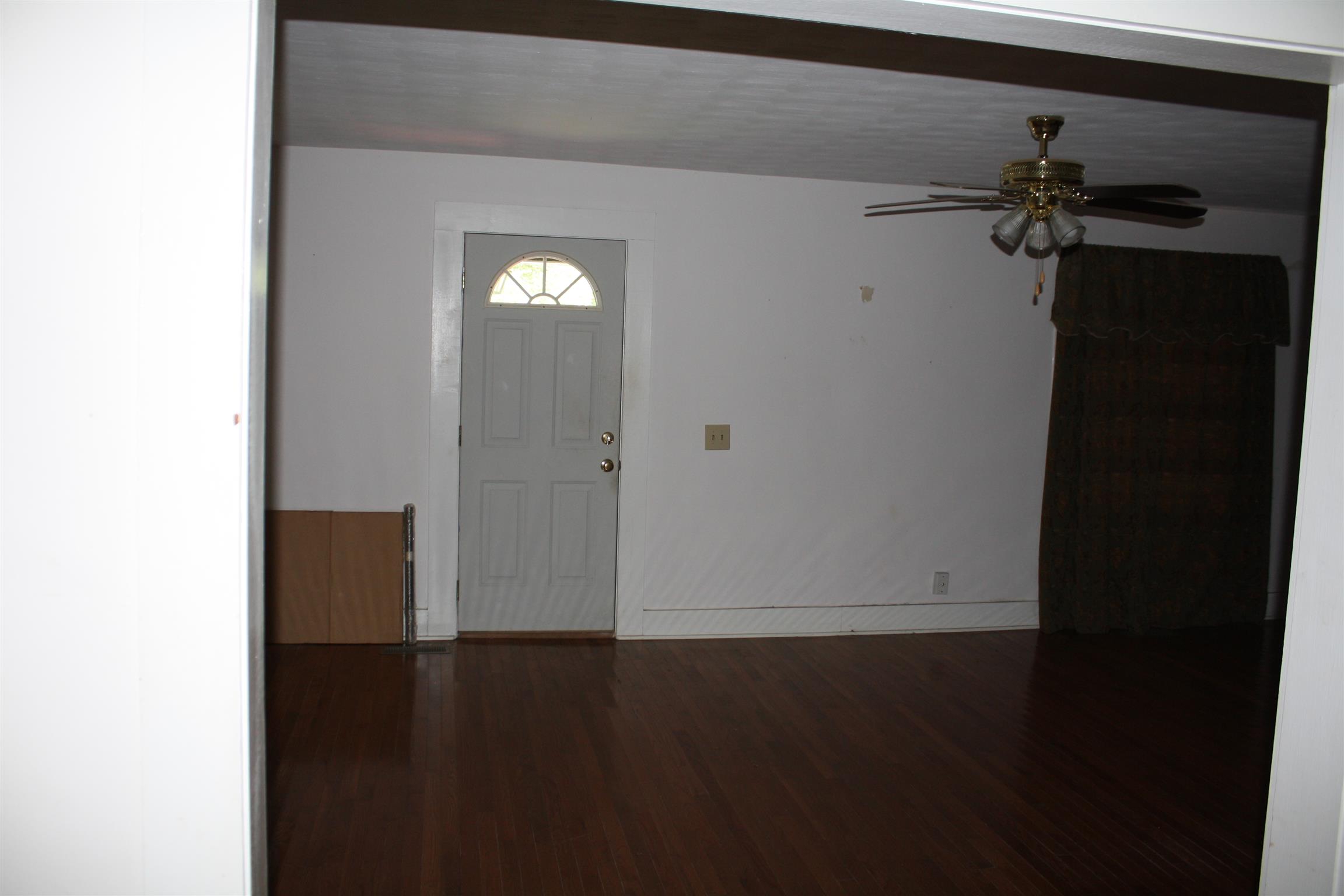 611 Fall River Road Lawrenceburg, TN 38464 - Photo 11 of 18 a view of empty room with wooden floor