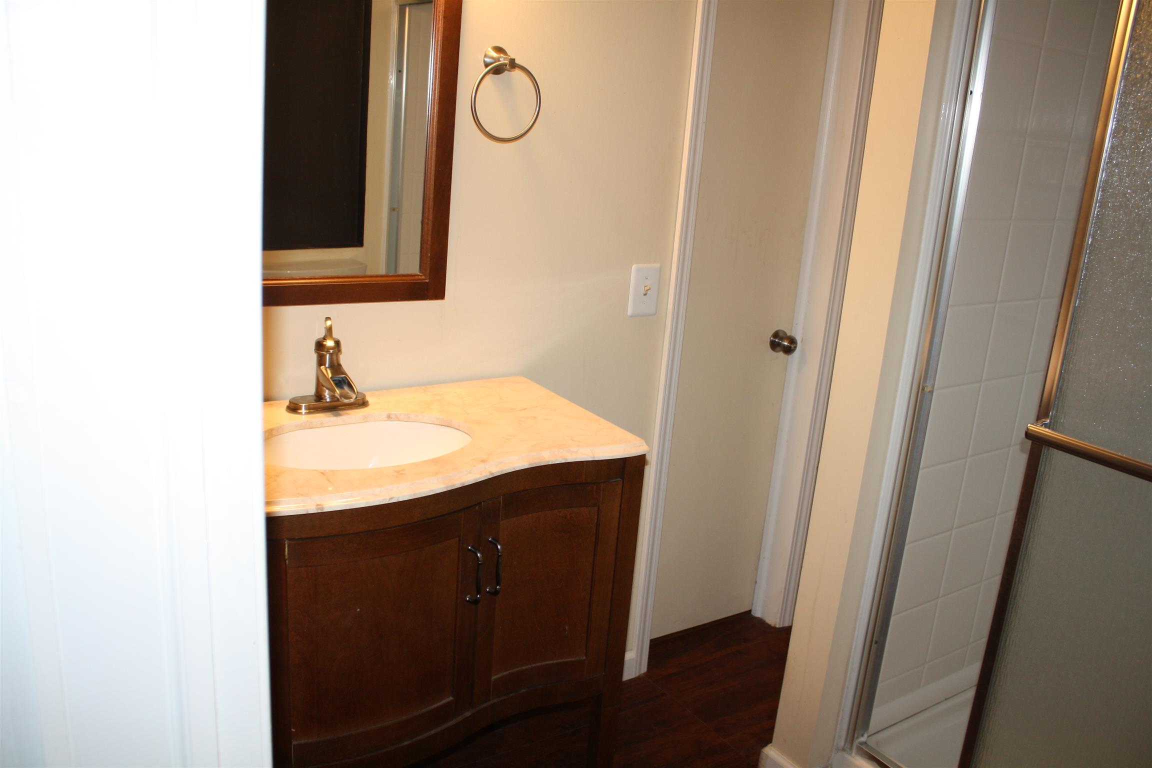611 Fall River Road Lawrenceburg, TN 38464 - Photo 14 of 18 a bathroom with a sink and a mirror