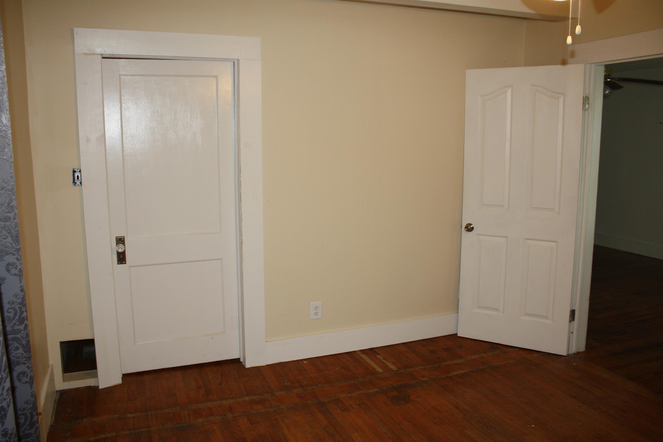 611 Fall River Road Lawrenceburg, TN 38464 - Photo 15 of 18 an empty room with wooden floor and closet
