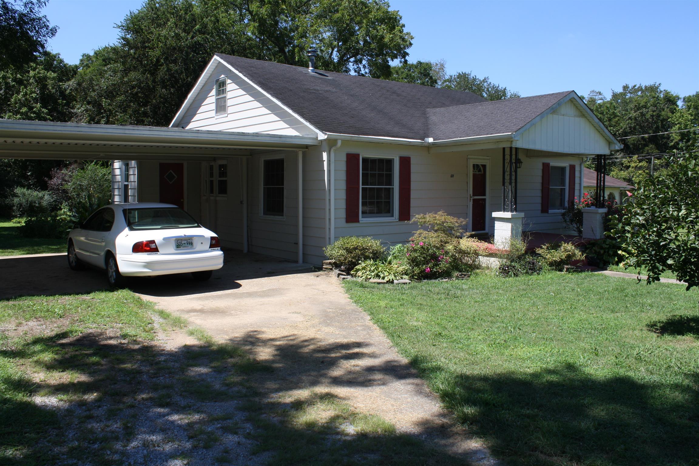 611 Fall River Road Lawrenceburg, TN 38464 - Photo 4 of 18 a front view of a house with a garden