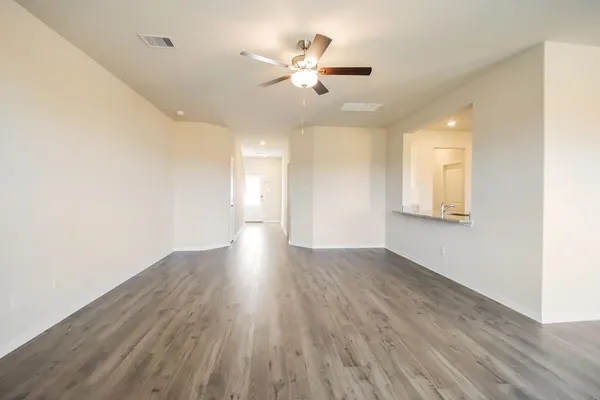 a view of a kitchen cabinets and wooden floor