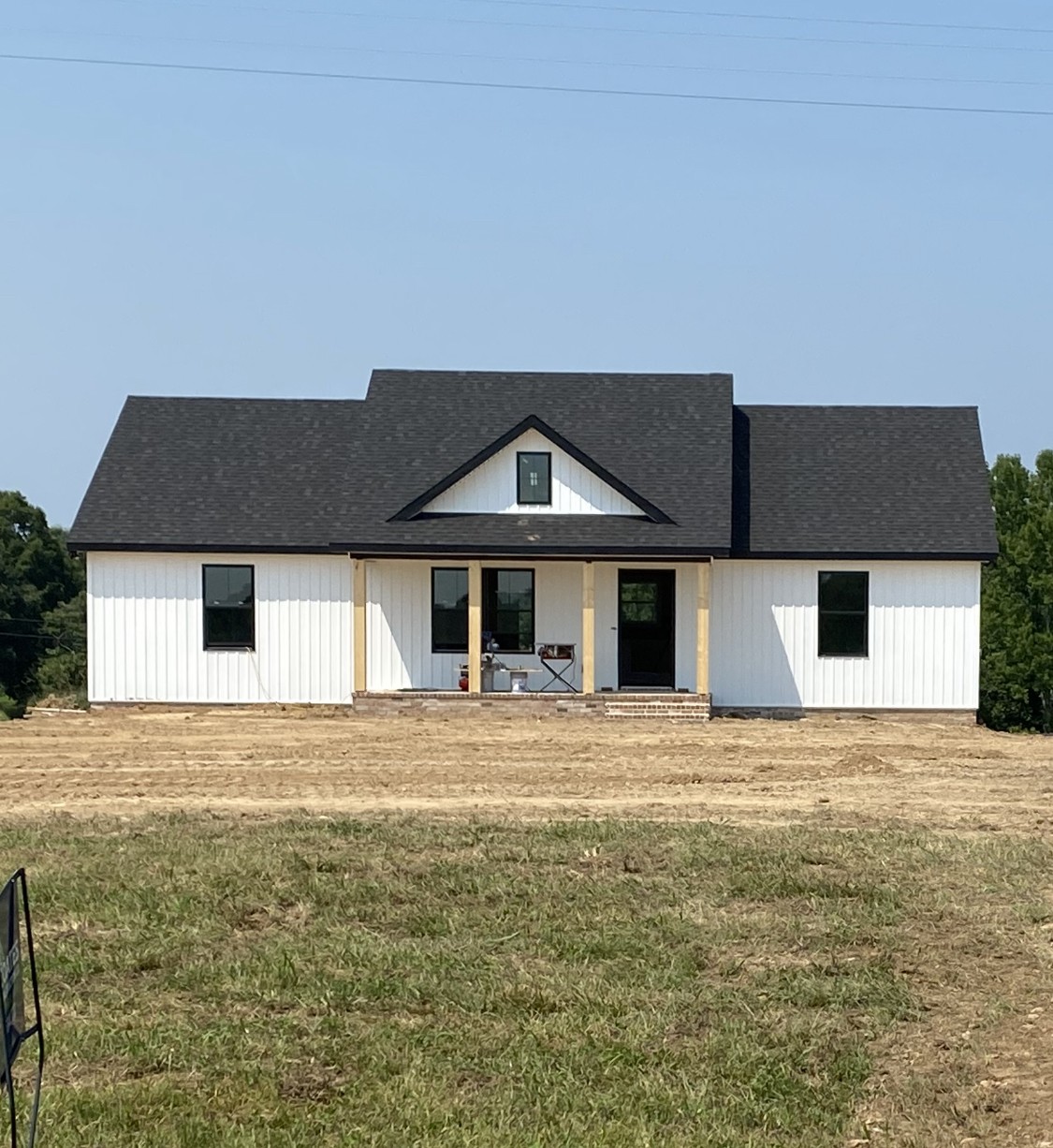587 Womack Road Bethpage, TN 37022 - Photo 1 of 1 a front view of a house with a yard and garage