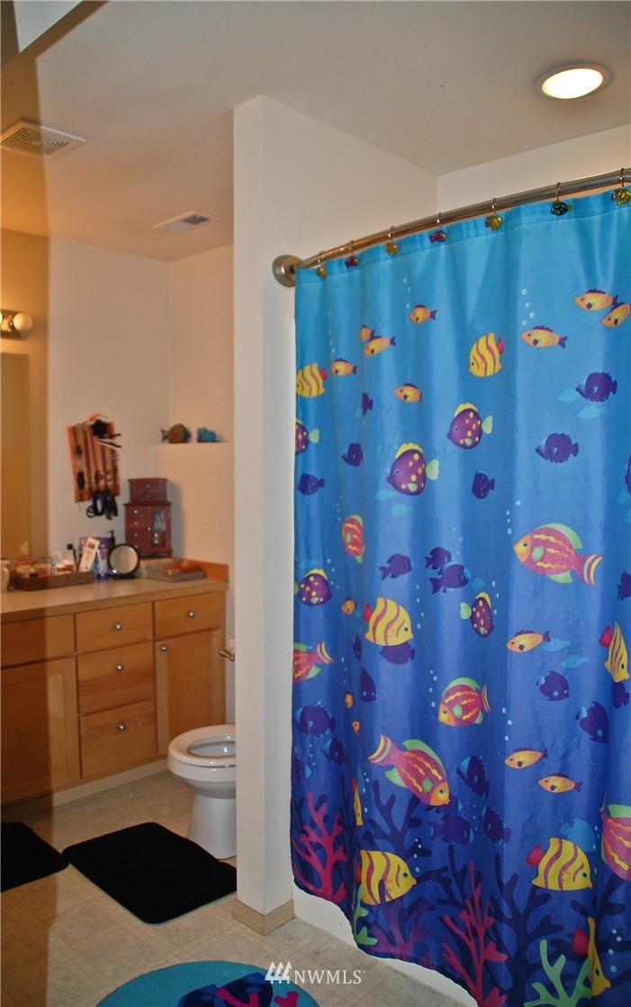3120 12th Street Everett, WA 98201 - Photo 6 of 12 a bathroom with a sink and a mirror