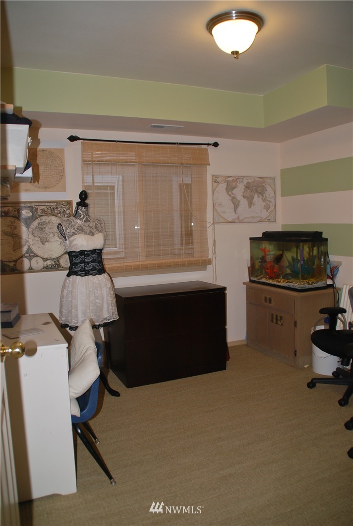 3120 12th Street Everett, WA 98201 - Photo 8 of 12 a room with furniture and a fireplace