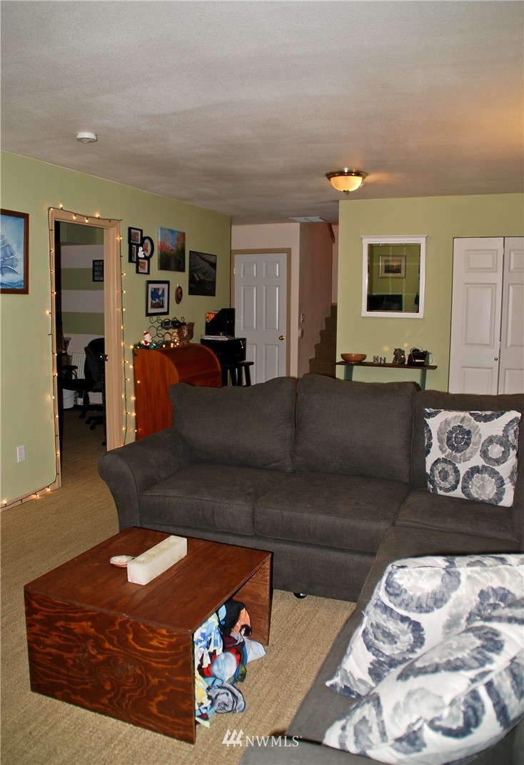 3120 12th Street Everett, WA 98201 - Photo 9 of 12 a living room with furniture window and dresser