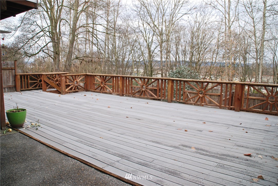 3120 12th Street Everett, WA 98201 - Photo 10 of 12 a view of balcony with wooden floor and fence