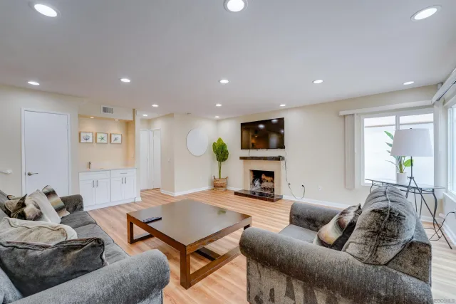 a living room with furniture or kitchen and a fireplace