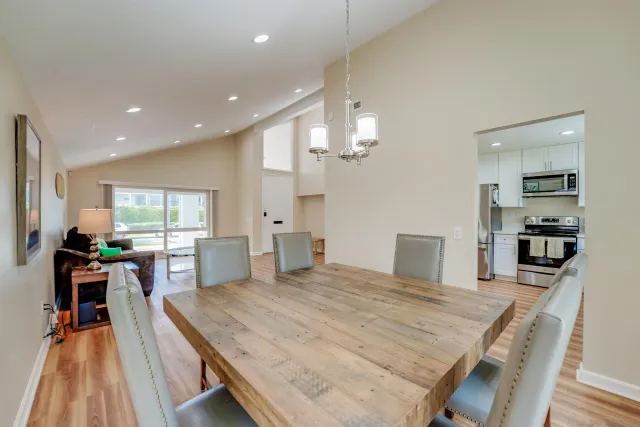 a kitchen with stainless steel appliances granite countertop counter space a sink refrigerator and cabinets