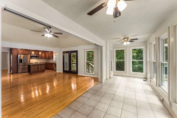 a view of an entryway with wooden floor