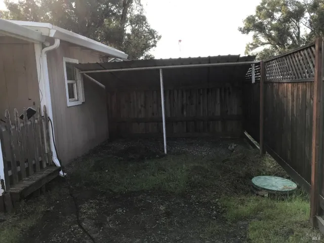a view of a back yard of the house