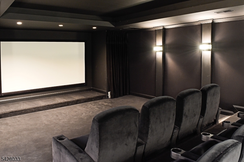 2 Chilton Road Chester, NJ 07930 - Photo 35 of 43 a living room with a projector and furniture