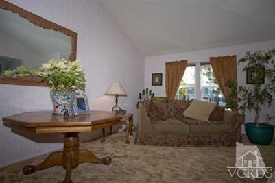 1131 Rivas Lane Oxnard, CA 93035 - Photo 4 of 10 a living room with furniture and a potted plant