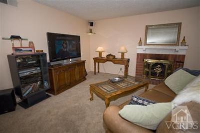 1131 Rivas Lane Oxnard, CA 93035 - Photo 5 of 10 a living room with furniture and a fireplace