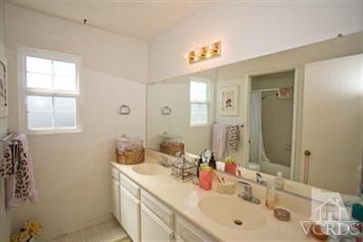 1131 Rivas Lane Oxnard, CA 93035 - Photo 8 of 10 a bathroom with a sink and a mirror