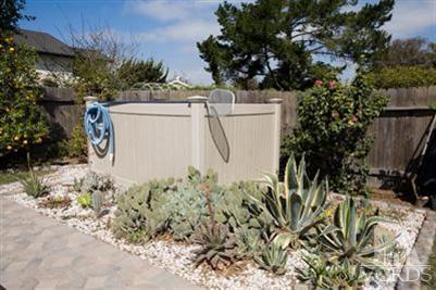 1131 Rivas Lane Oxnard, CA 93035 - Photo 10 of 10 a utility room with dryer and potted plants