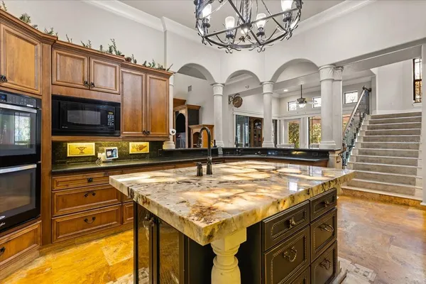 a bed sitting in a room next to a window