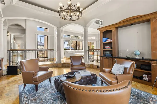 a bedroom with furniture and a window