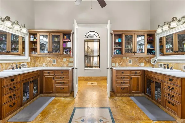 a bedroom with a bed and a couch with exposed radiator