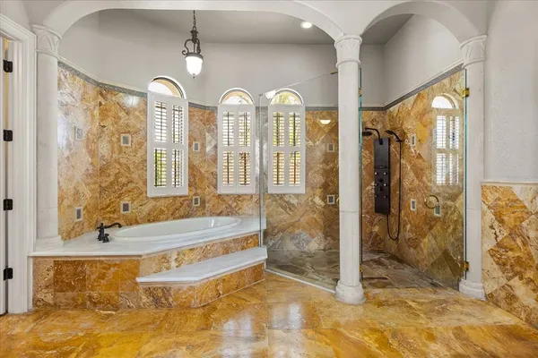 a bathroom with a sink vanity mirror and toilet