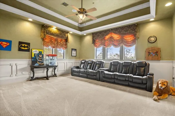 a spacious bedroom with a bed and a flat screen tv