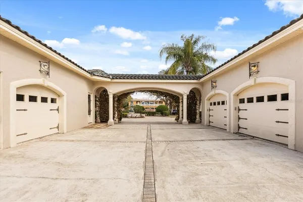 a living room with furniture and a large mirror