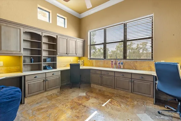 a bathroom with a granite countertop sink a toilet a mirror and shower