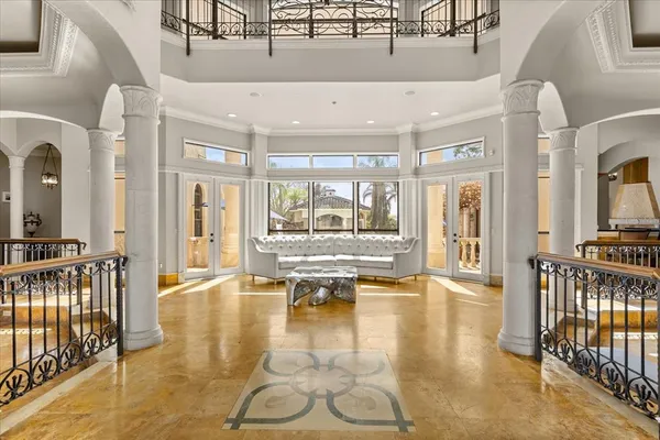 a kitchen with stainless steel appliances a stove center island cabinets and a chandelier
