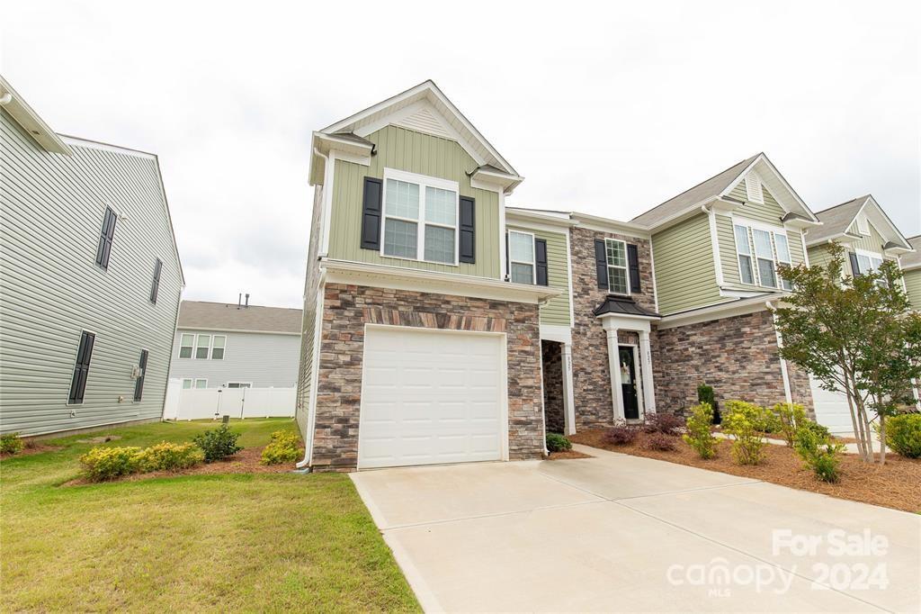 825 Canoe Song Road Fort Mill, SC 29708 - Photo 2 of 17 a front view of a house with a yard