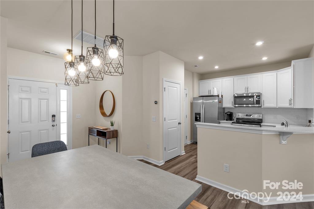 825 Canoe Song Road Fort Mill, SC 29708 - Photo 4 of 17 a kitchen with refrigerator and cabinets