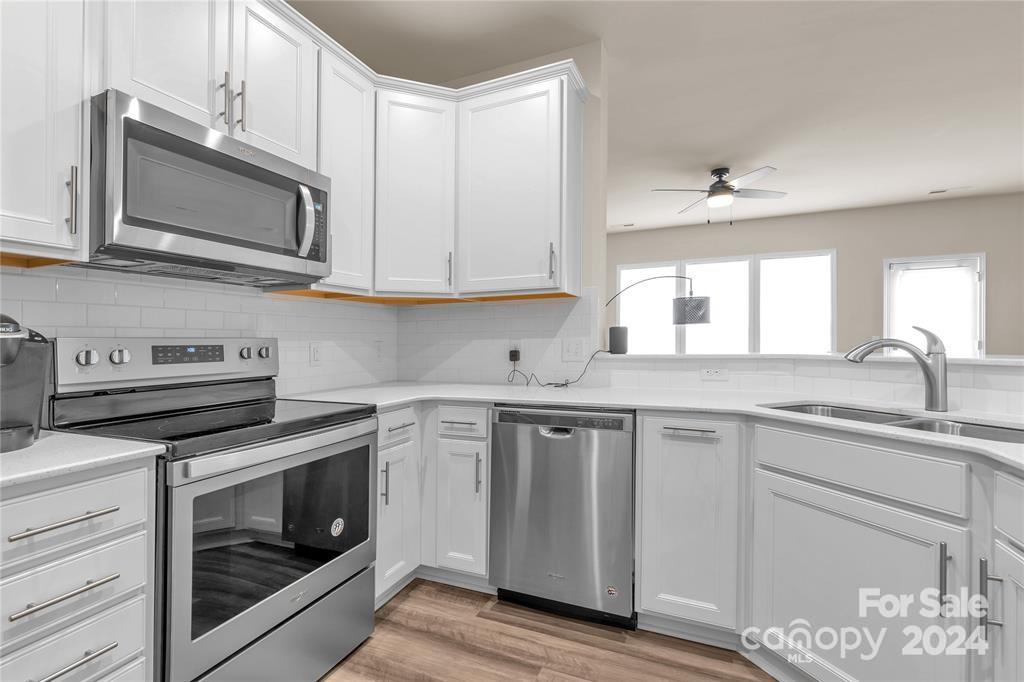 825 Canoe Song Road Fort Mill, SC 29708 - Photo 5 of 17 a kitchen with cabinets appliances and a sink