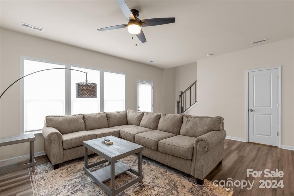 825 Canoe Song Road Fort Mill, SC 29708 - Photo 7 of 17 a living room with furniture and a large window