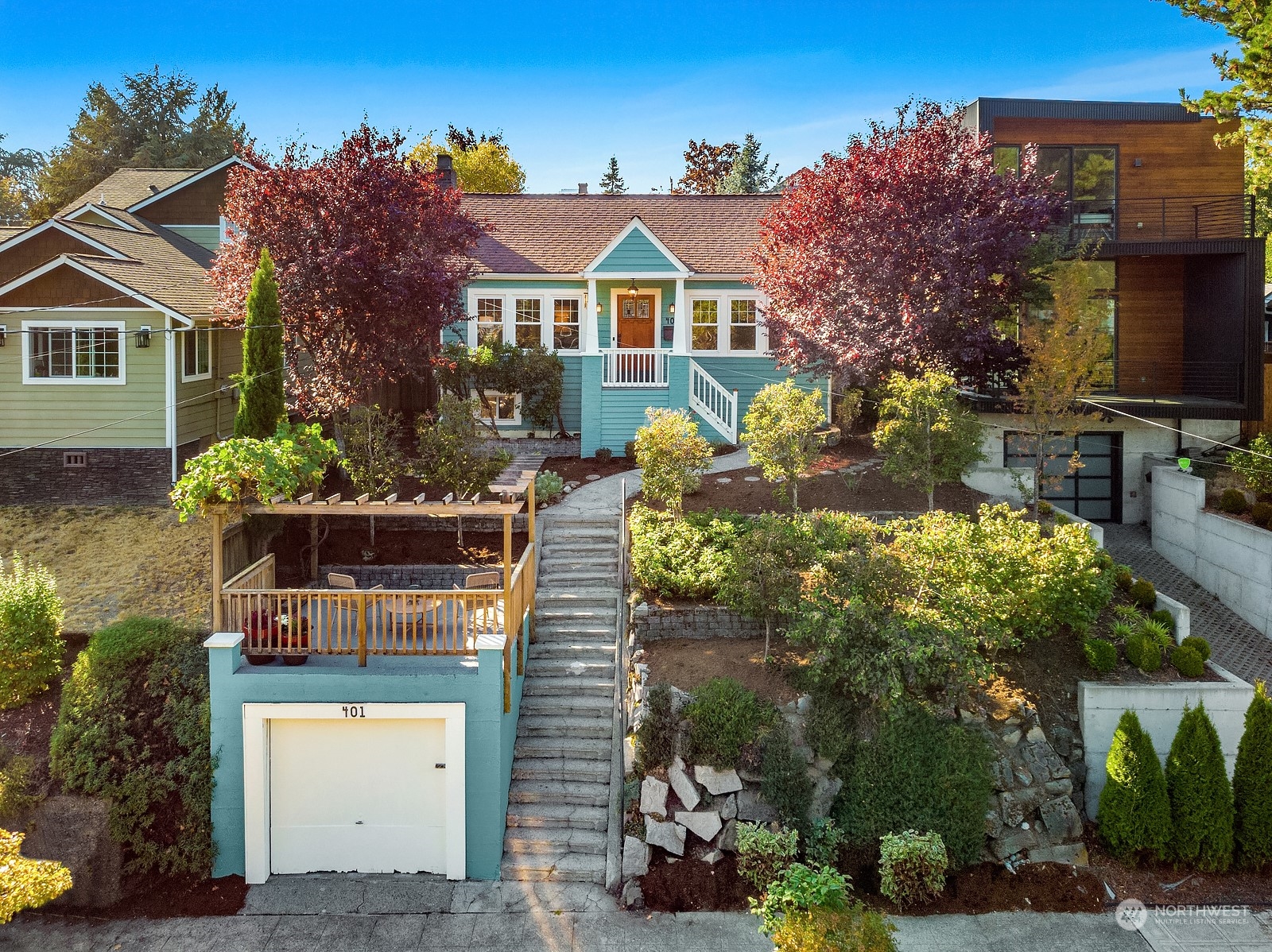 a front view of a house with a yard with a fountain