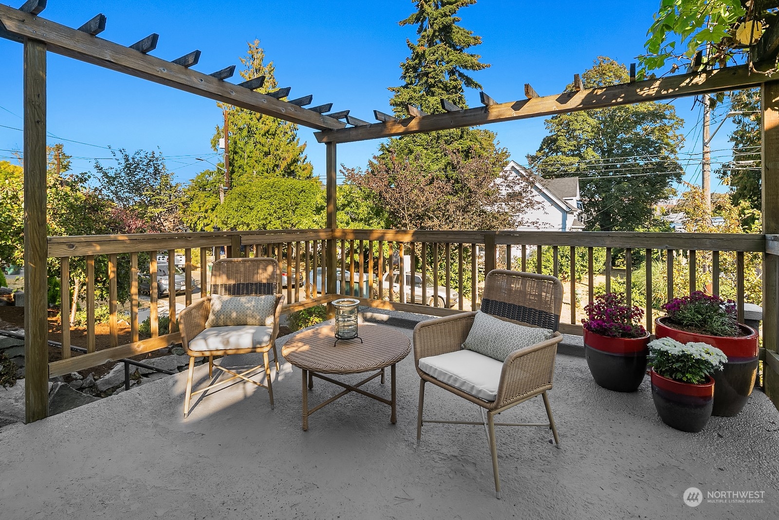 401 20th Avenue Seattle, WA 98122 - Photo 2 of 28 a balcony with wooden floor and outdoor seating