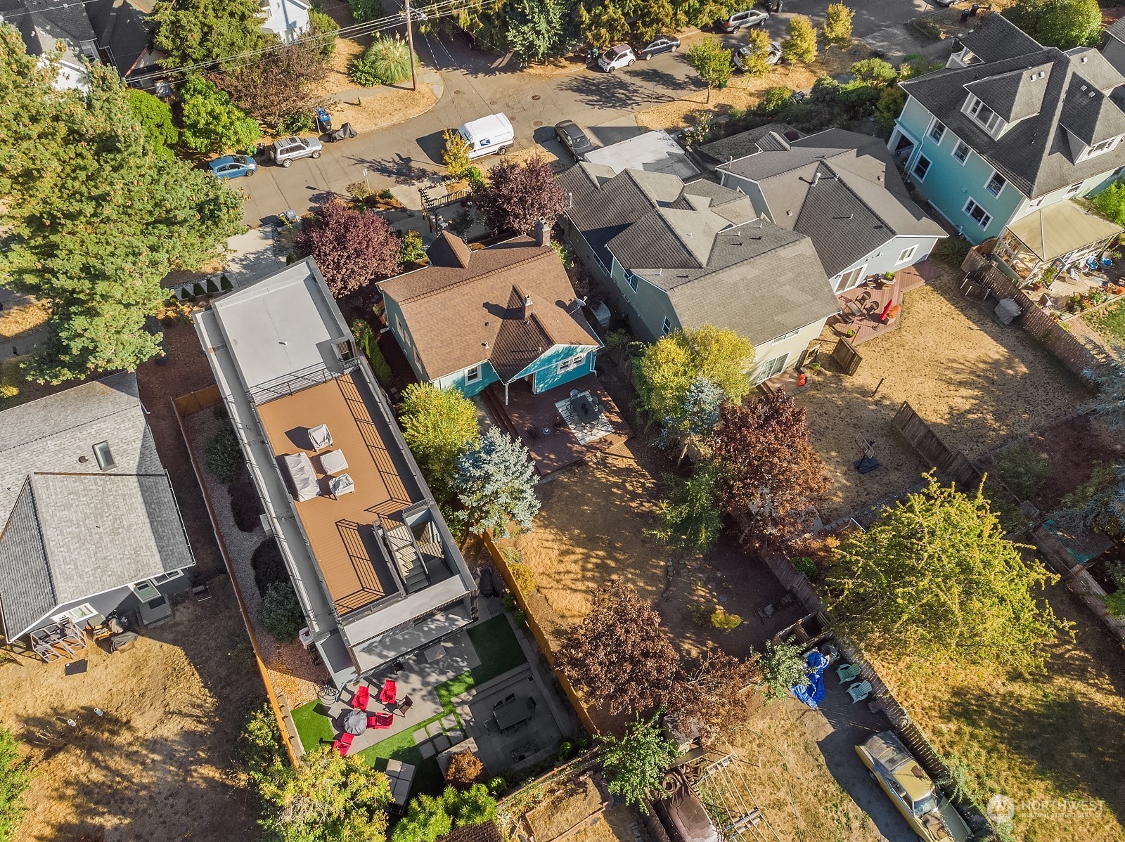 401 20th Avenue Seattle, WA 98122 - Photo 27 of 28 an aerial view of a house with a yard and a mountain view in back