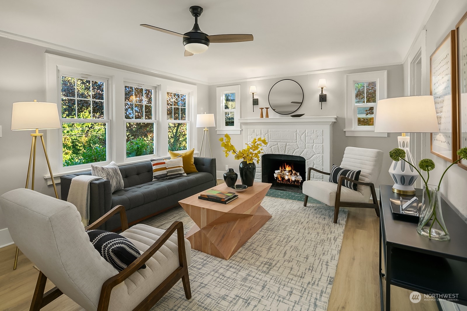 401 20th Avenue Seattle, WA 98122 - Photo 3 of 28 a living room with furniture fireplace and a large window