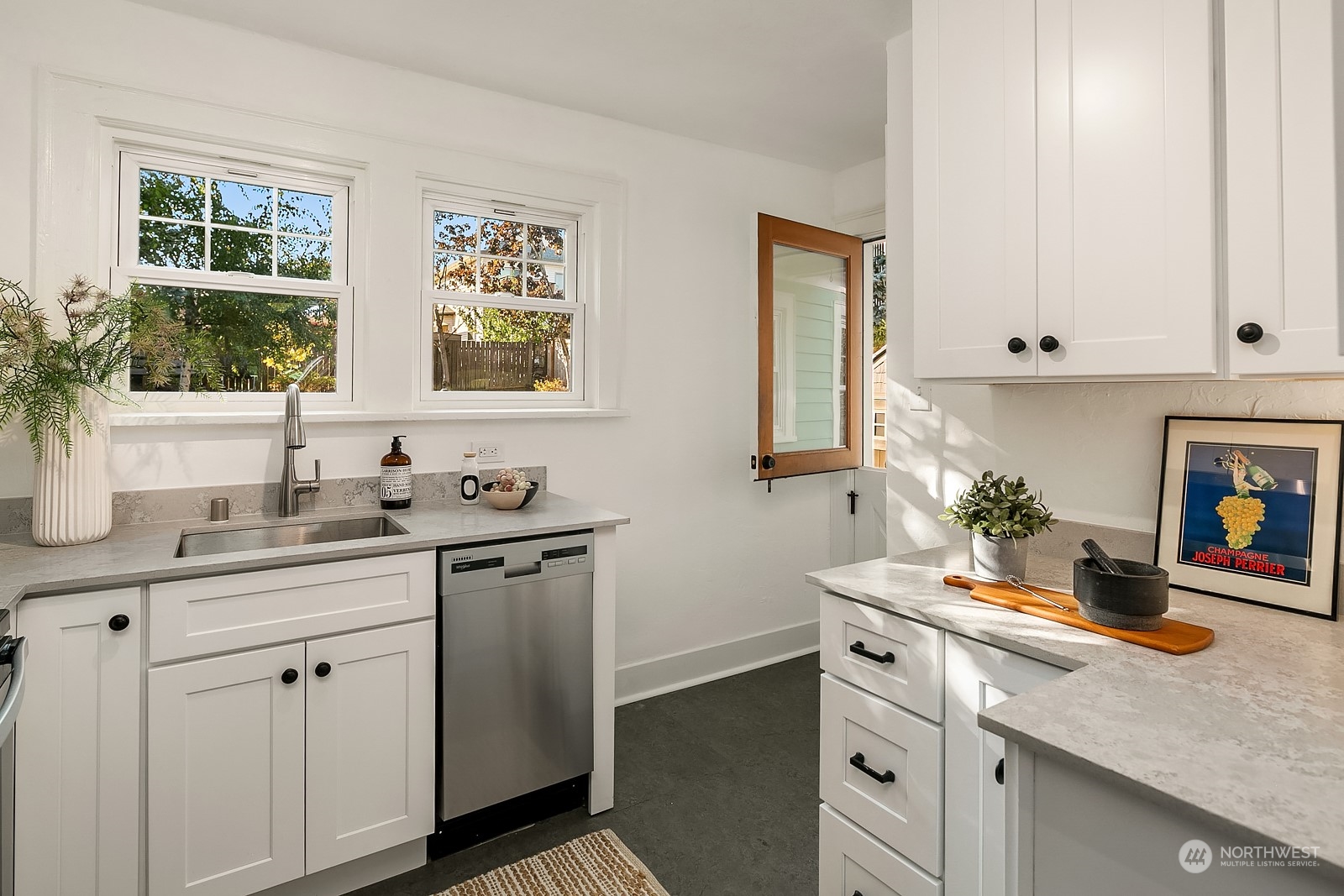 401 20th Avenue Seattle, WA 98122 - Photo 9 of 28 a kitchen with sink and cabinets