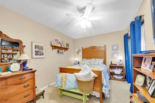 a bedroom with furniture and a baby crib