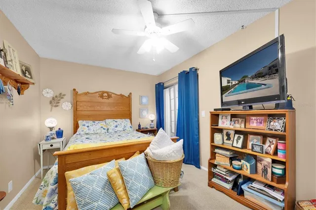 a bedroom with a bed and a book shelf
