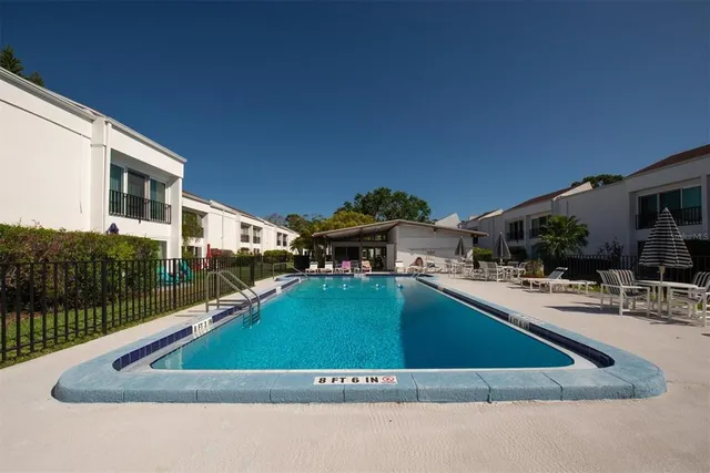 a view of outdoor kitchen and swimming pool