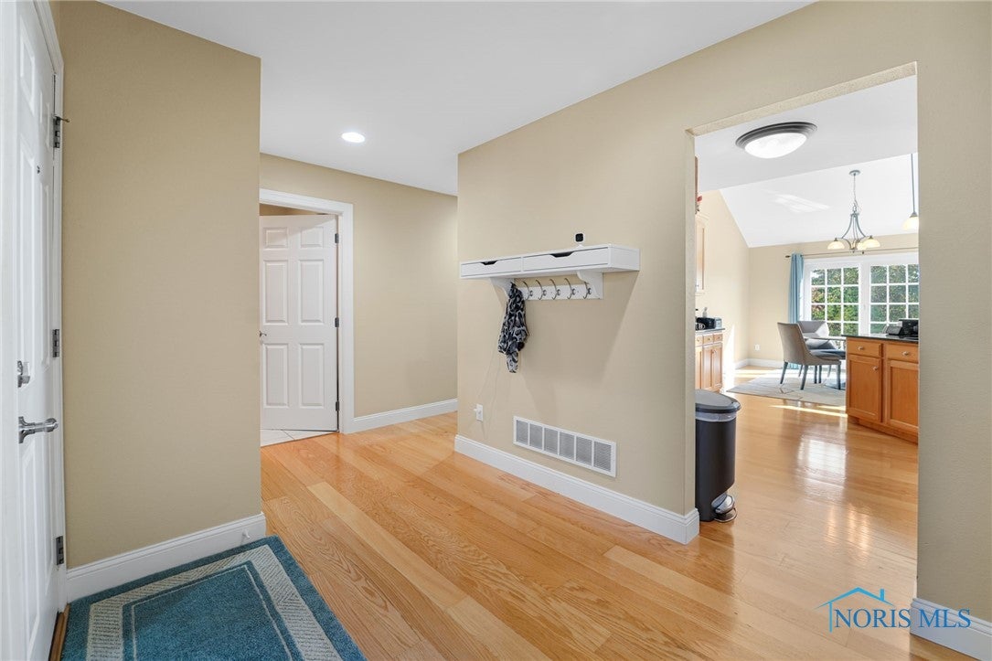 5841 Waterville Monclova Road Waterville, OH 43566 - Photo 21 of 39 This is the hallway leading to the garage, the laundry room and the primary bedroom.