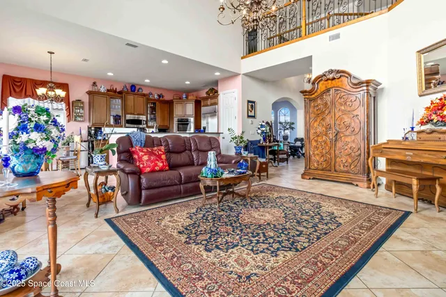 a living room with furniture a window and a flat screen tv