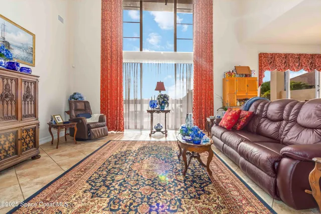 a kitchen view with stainless steel appliances kitchen island granite countertop a refrigerator and cabinets