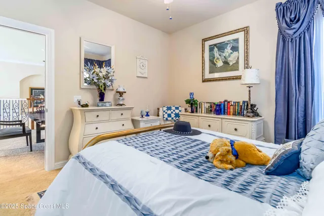 a bedroom with furniture and a dresser